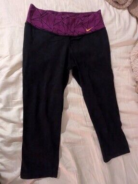 Nike Black Capri Leggings with Purple Patterned Waistband and Orange Swoosh